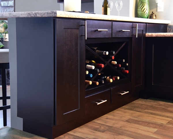 kitchen peninsula built of black-stained birch cabinets has large wine rack and single drawers kitchen peninsula built of black-stained birch cabinets has large wine rack and single drawers