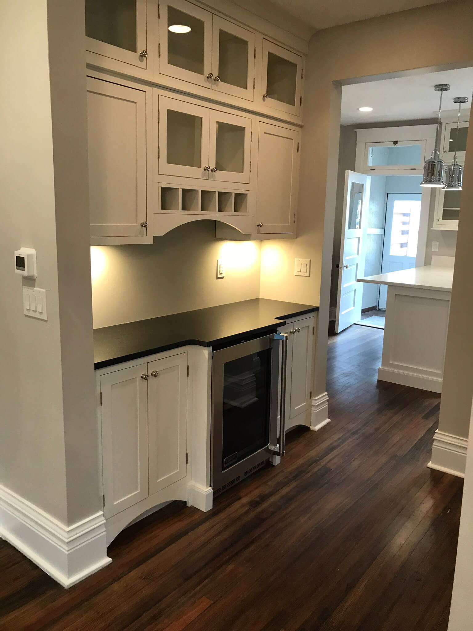 Vintage Bar Cabinets. This image is of vintage bar cabinets in a house. If you are drawn to a more eclectic or retro-inspired interior design style, you can create a vintage bar cabinet design within your own home.