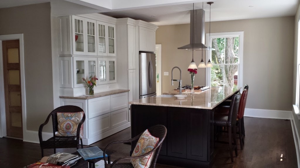 kitchen with white glass door cabinets in buffet and black shaker cabinets in island kitchen with white glass door cabinets in buffet and black shaker cabinets in island