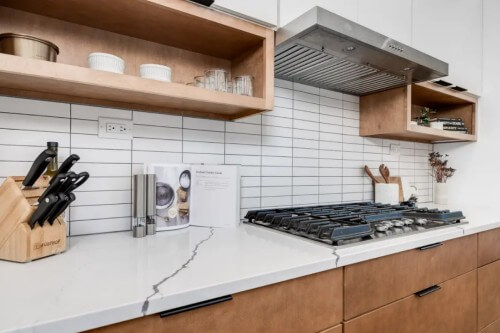White and light wood slab cabinet door kitchen White and light wood slab cabinet door kitchen with white uppers and wood base cabinets