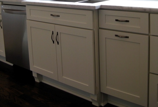 white shaker cabinets in sink area are bumped out with furniture feet white shaker cabinets in sink area are bumped out with furniture feet