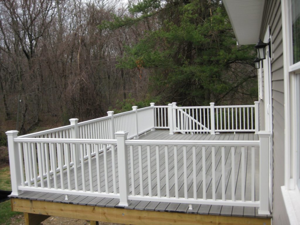 deck on new home has white railing and overlooks wooded Connecticut countryside. deck on new home has white railing and overlooks wooded Connecticut countryside.